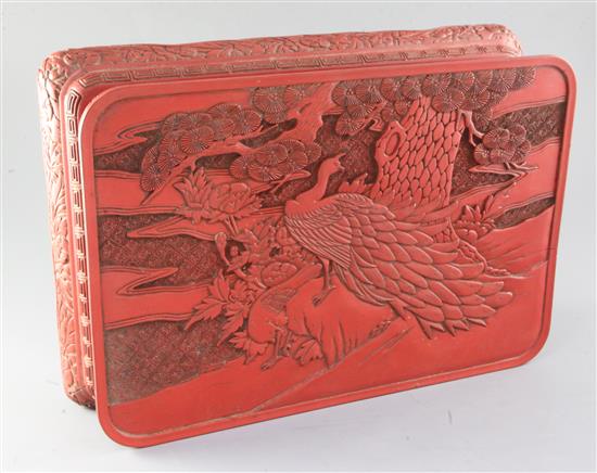 A Chinese red lacquer low table, 42cm long x 29.5cm deep